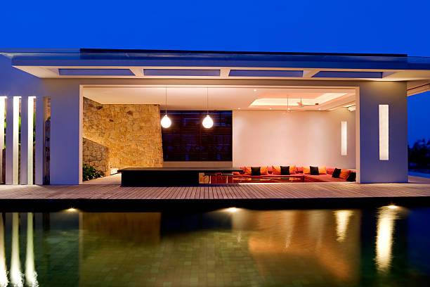 Island Villa At Dusk With Swimming Pool.